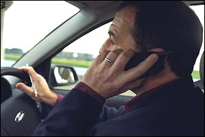 cell phone wielding uk drivers face two years in jail