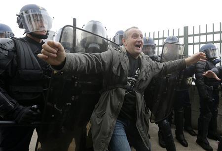 police defends paris auto show with teargas