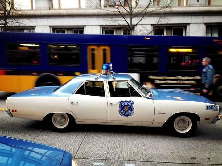 historic police car spotted responding to call on the not so mean streets of seattle