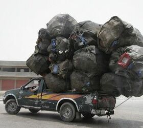 Overloaded transport pictures: If ever a car was going to break