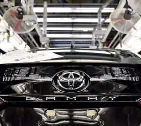 toyota scales back june production ford drops german factory