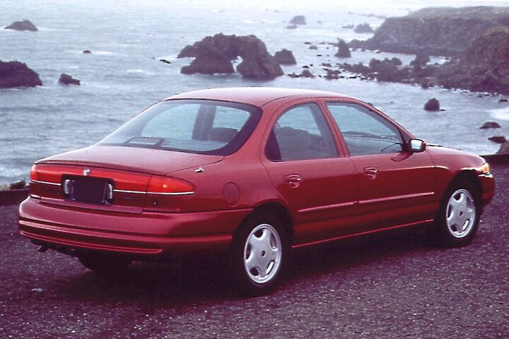 buy drive burn upmarket brand american midsize sedans in 1997