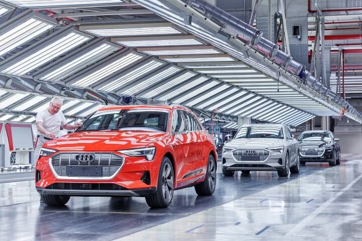 report audi e tron production stalled over suspected battery shortage
