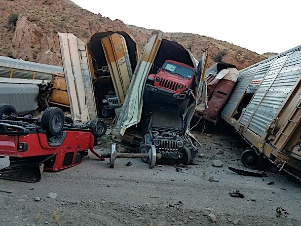 Train Carrying New Jeep Gladiator and GMC Sierra Pickups Derails Causing Carnage
