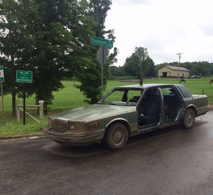 freaky friday cops stop lincoln town car with no doors or windshield axe stuck in