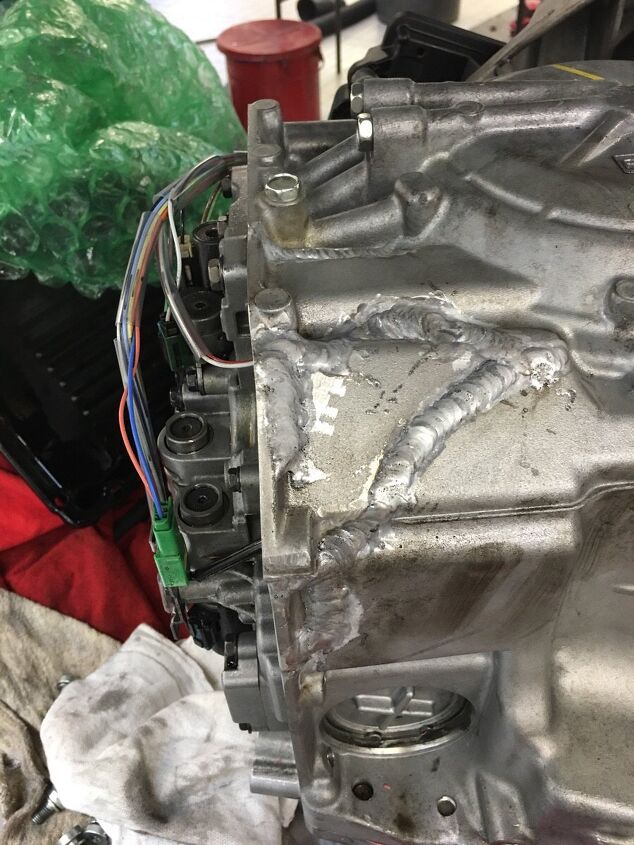 dealer technician drops cracks welds and attempts to stuff transmission back in