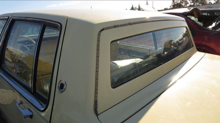 junkyard find 1987 cadillac sedan de ville world s yellowest leather interior