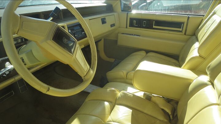 junkyard find 1987 cadillac sedan de ville world s yellowest leather interior