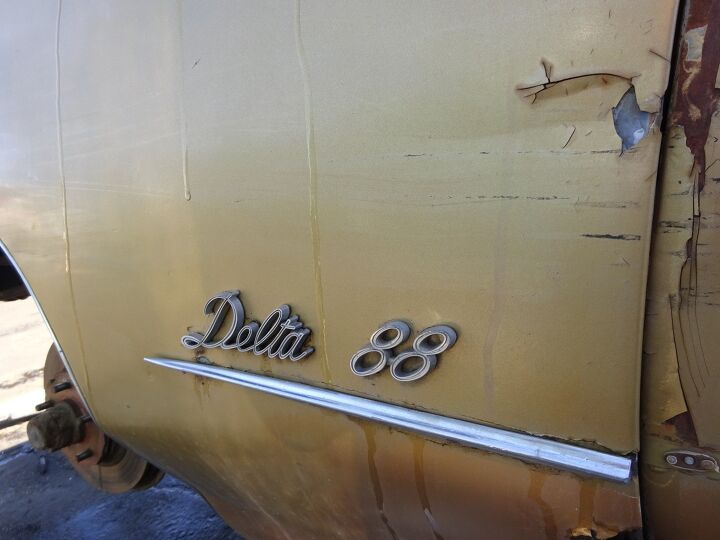 junkyard find 1973 oldsmobile delta 88 custom with bonus 1993 newspapers
