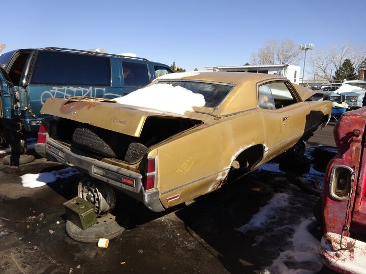 junkyard find 1973 oldsmobile delta 88 custom with bonus 1993 newspapers