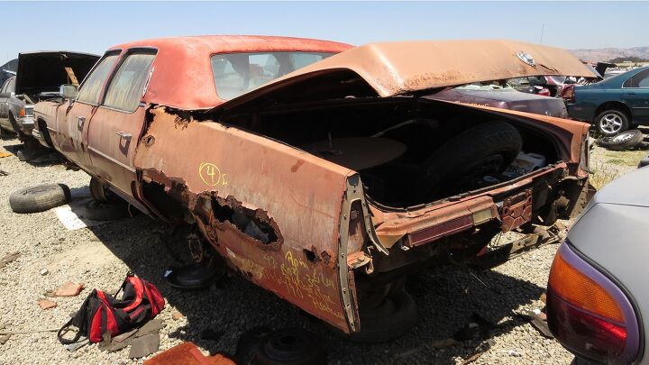junkyard find 1974 cadillac fleetwood terrifying ocean rust edition