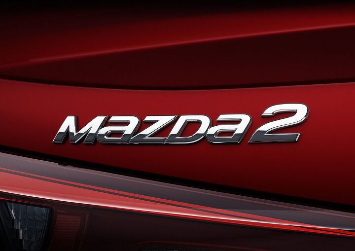 mazda2 sedan gives hints to next scion