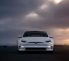 report couple charged 20k after their tesla s battery got rained on