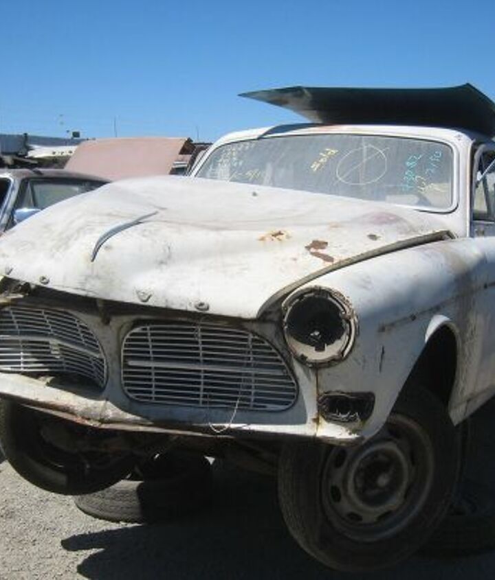 junkyard find pair of volvo amazons