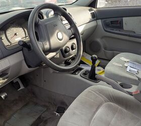 junkyard find 2004 kia spectra with 448 559 miles