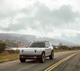 rivian grows revenue cuts losses as it readies for q2 debut of all new r2